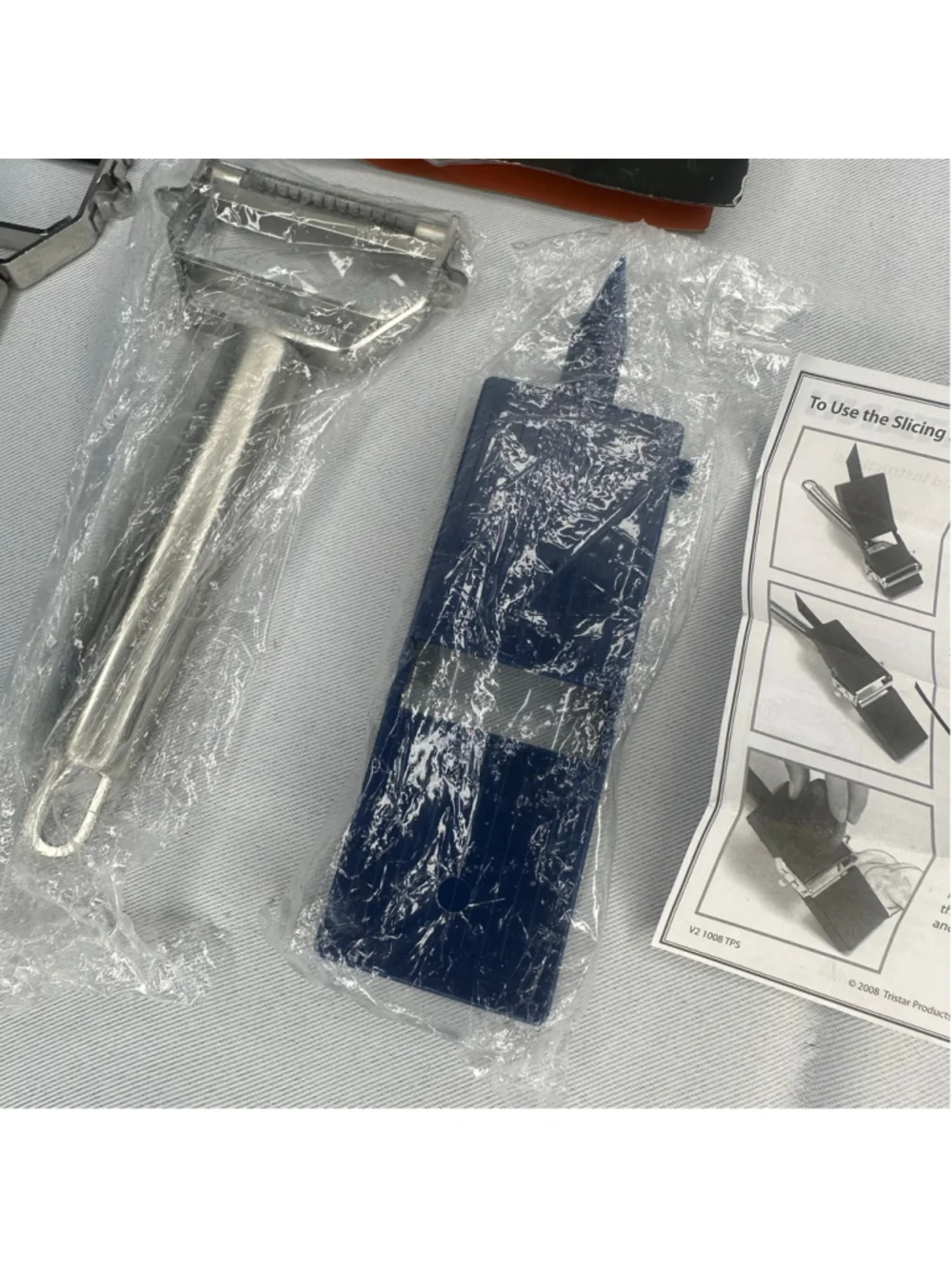 New Titan Stainless Steel Peeler Slicer As Seen On TV Blue Board Guide Book Set